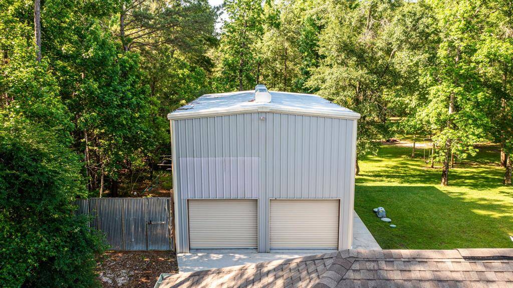 A closer aerial showcases the impressive size of the detached garage/workshop.