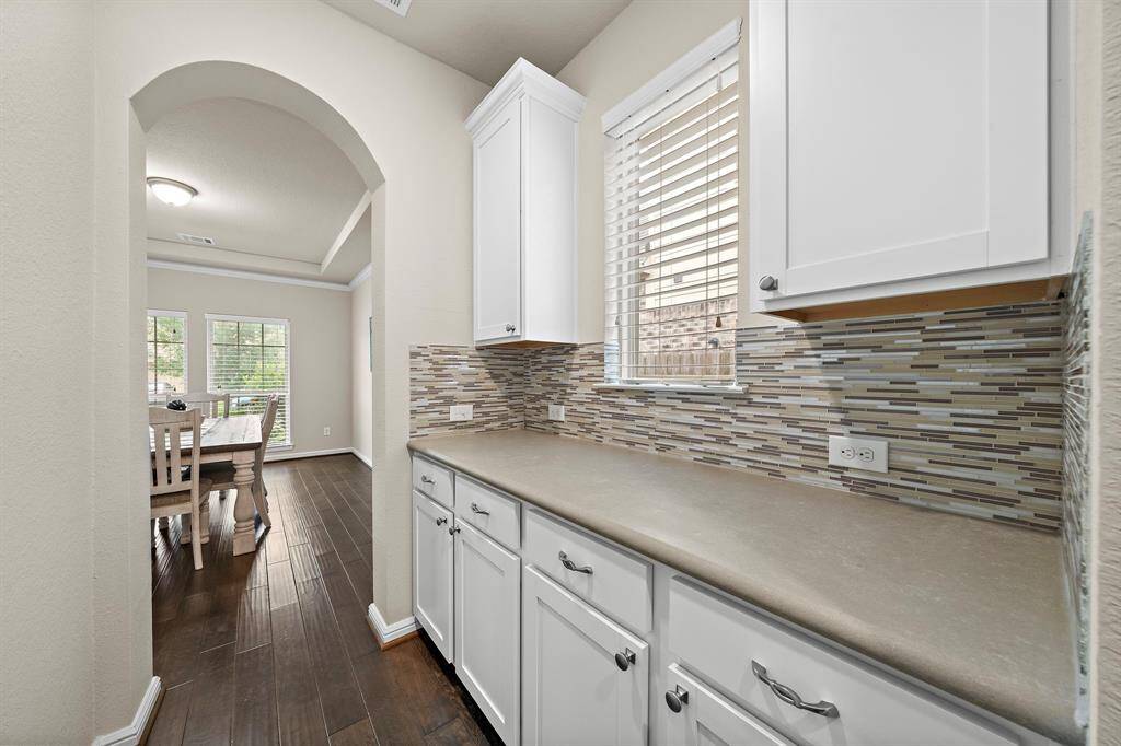 The butler's pantry is locatd between the kitchen and formal dining room making this a great spot for serving food or tucking items away.
