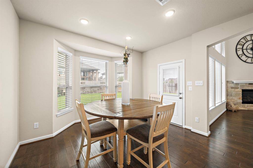 The breakfast area is located off of the kitchen.