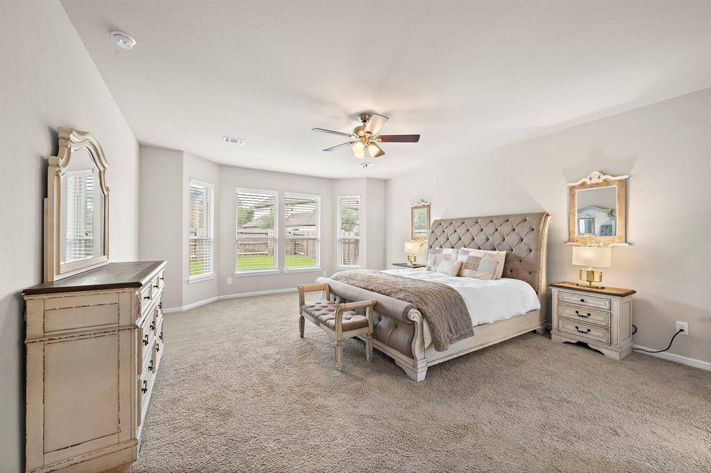 The oversized primary suites features bay windows making this a great sitting area.