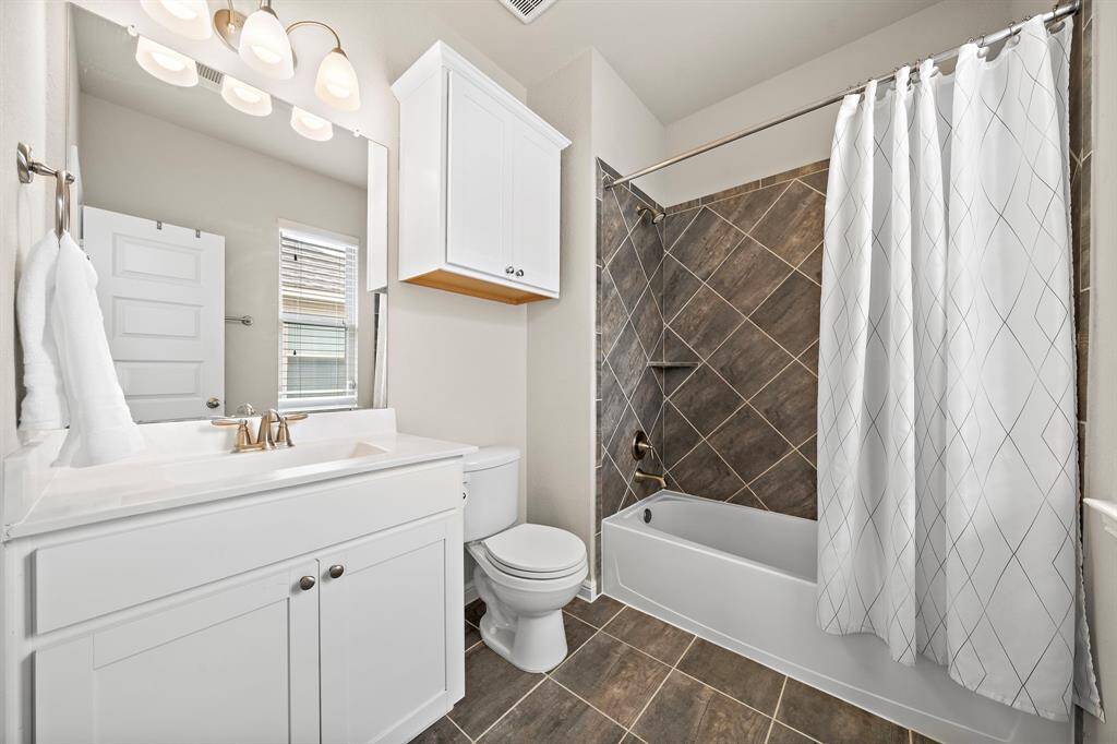 Full bathroom #3 located inside of Bedroom #3 on the first floor.