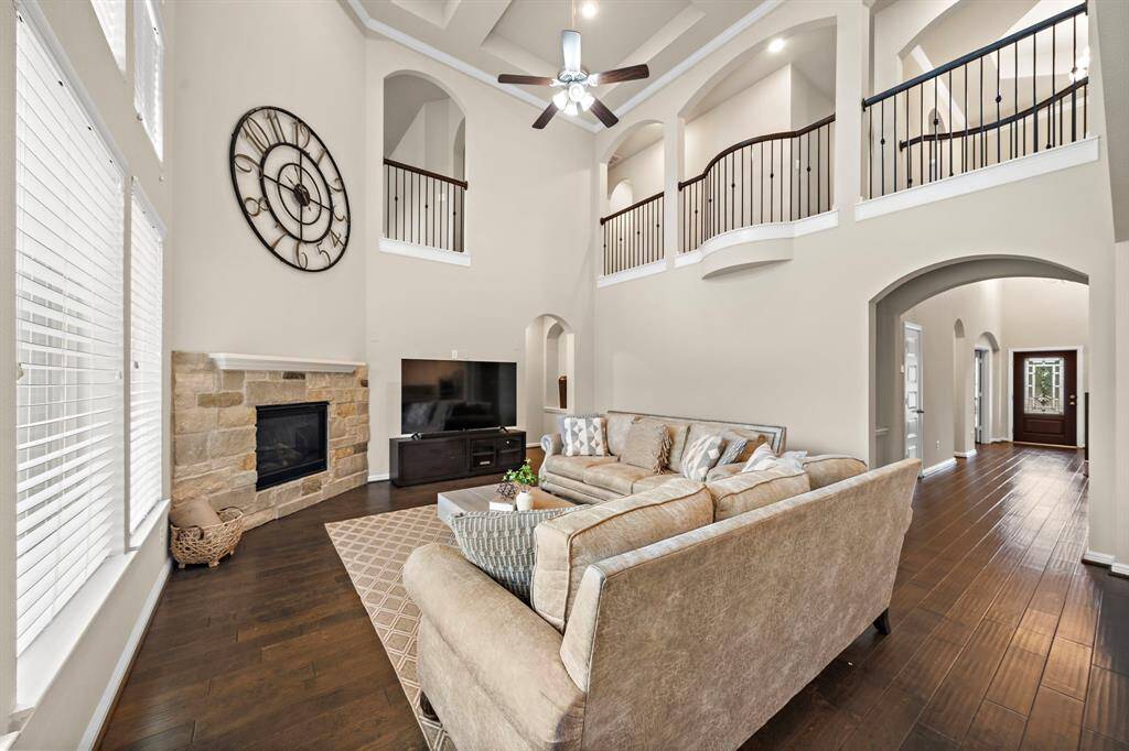The living room features a gas log fireplace.
