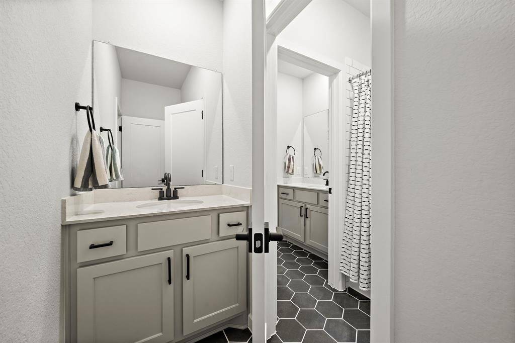 Full bathroom #2 shared between bedrooms #2 and #3, and features a Jack and Jill bathroom with seperate private vanities.