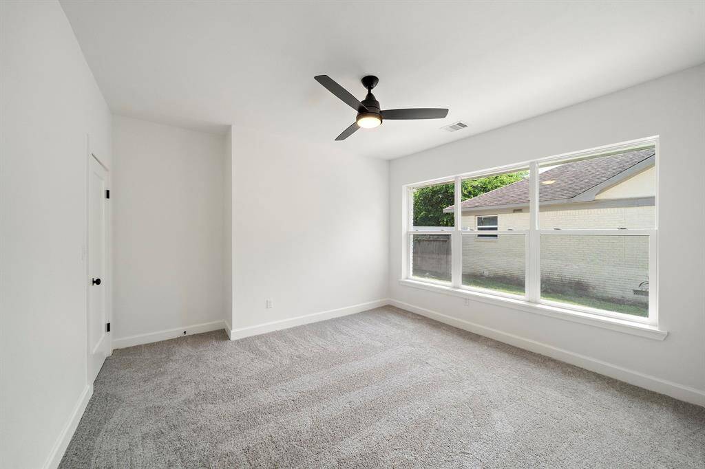Bedroom boasting large windows to let in the light.