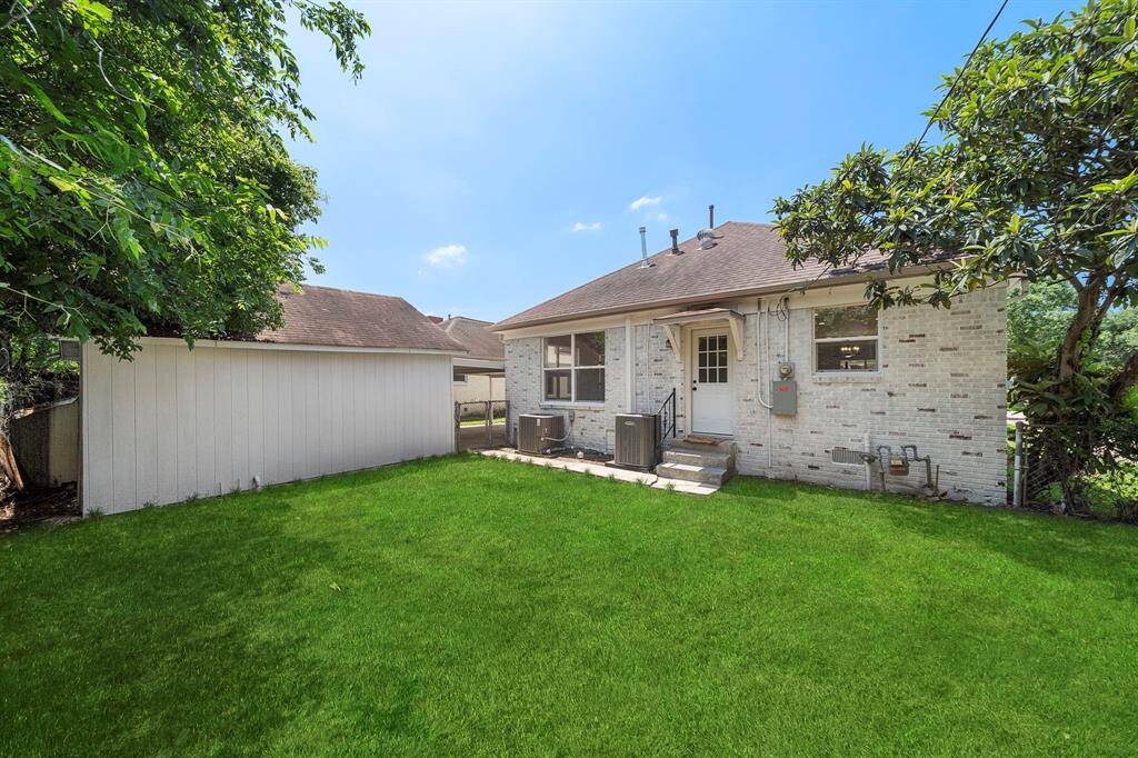 Thoughtfully designed backyard with freshly installed sod ready for you to make it your own