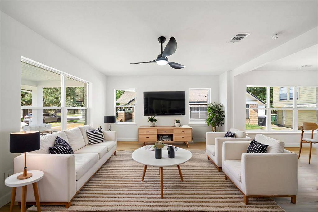 These beautiful windows and floors make this space feels both warm and welcoming!