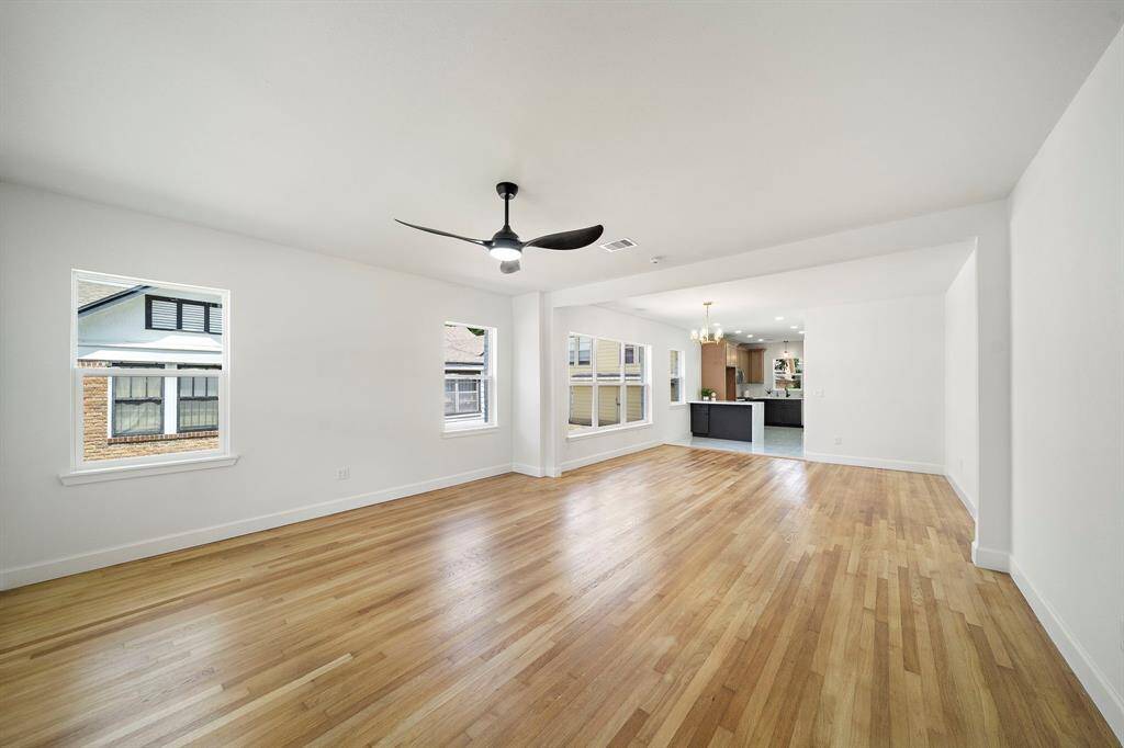 Step into a spacious open concept area that blends timeless character with modern conveniences.