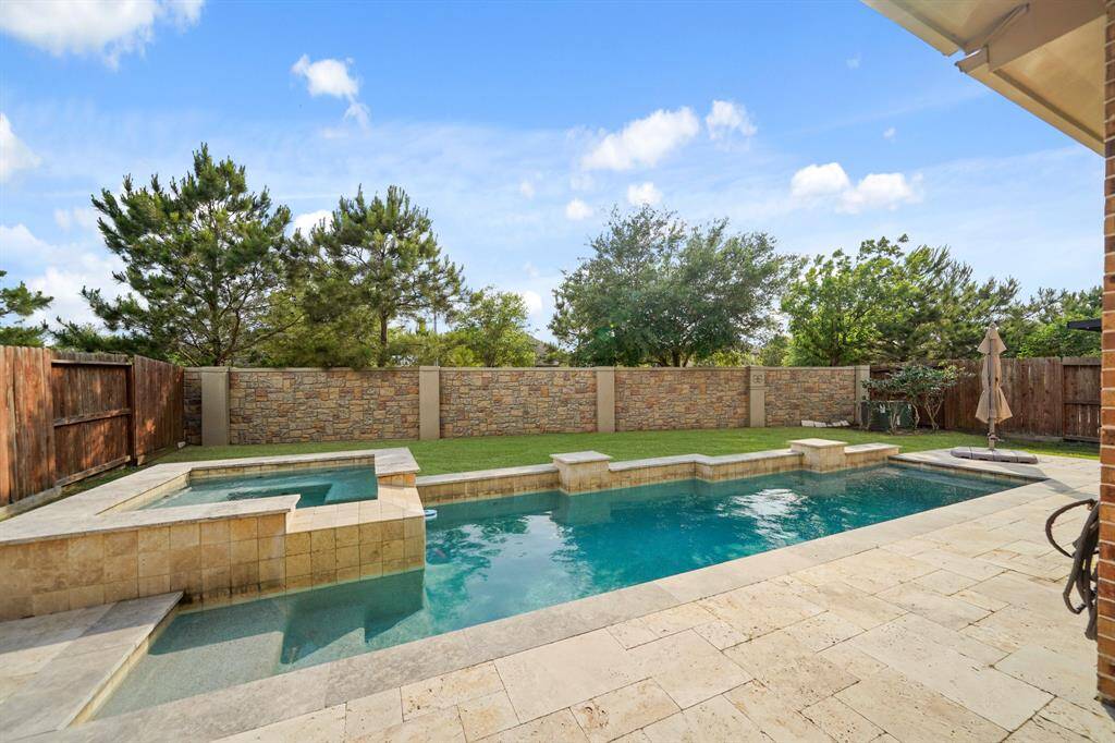 Check out this incredible pool and spa to go along with this overall stunning home.