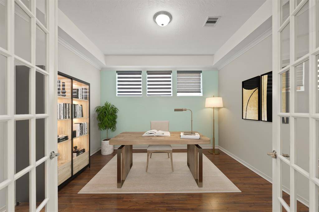 Virtually Staged: Behind this double glass doors you will find this handsome office with wood floors, and a tray ceiling.