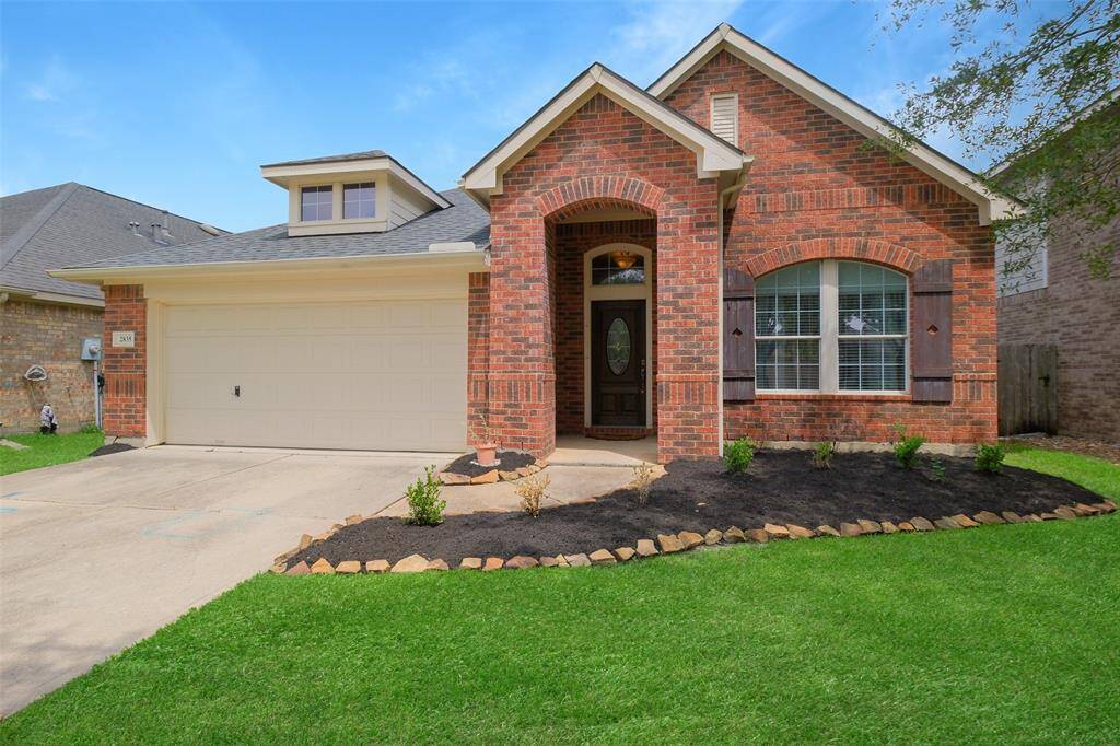 Located in the master-planned Firethorne community and zoned to award-winning Katy ISD, this charming red brick home offers standout curb appeal with a welcoming front porch, freshly mulched landscaping, and rich wood shutters that add warmth and character.