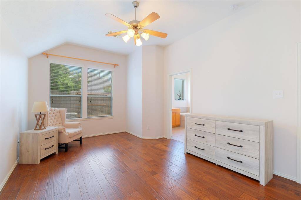 Even with all bedrooms being located on the first floor, the split floor plan offers privacy with a secluded master suite tucked away at the rear of the home, featuring rich engineered wood floors, an elevated gambrel ceiling, soft natural light, and direct access to the en-suite bath.