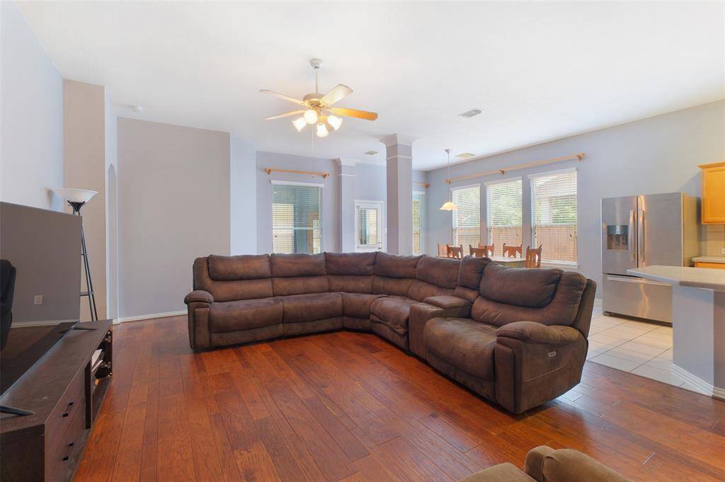 Abundant natural light fills this open-concept living space, with a seamless flow from the family room to the breakfast area and kitchen. The master retreat is tucked off of the back left side of the family room.