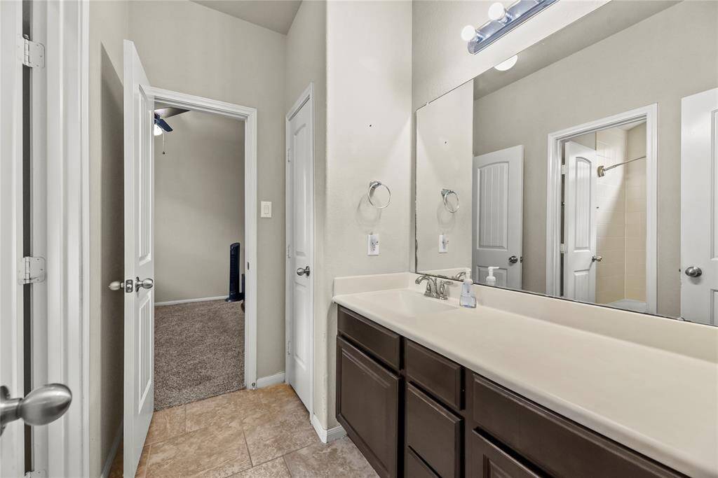 The secondary bathroom is stylishly appointed and thoughtfully designed for comfort and convenience.
