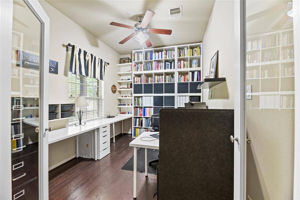 A private study through double glass doors adds a touch of sophistication and privacy to the home. It suggests a space dedicated to concentration, creativity, and productivity.