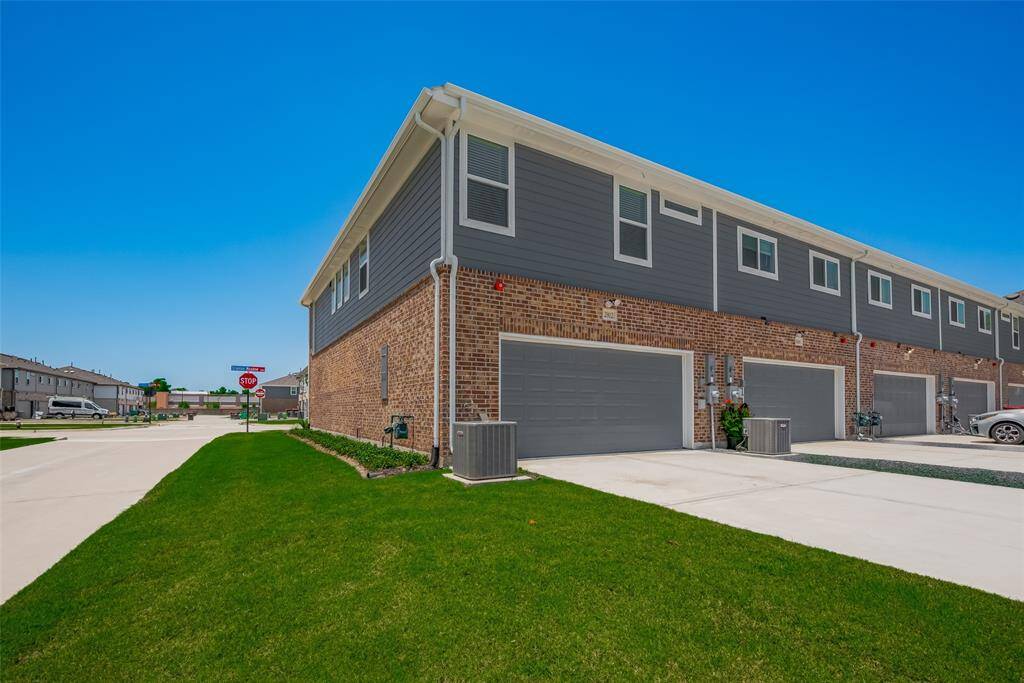 The home features a back entrance leading into the oversized garage, with plenty of additional parking space in the driveway for your convenience.