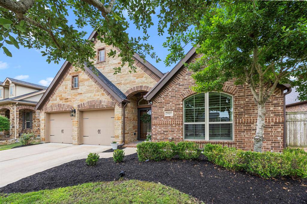 Gorgeous Perry home with brick & stone exterior, beautiful architectural details, well manicured lush landscaping with mature trees and fresh mulch. All situated on a nice size lot in highly sought after Cross Creek Ranch community.