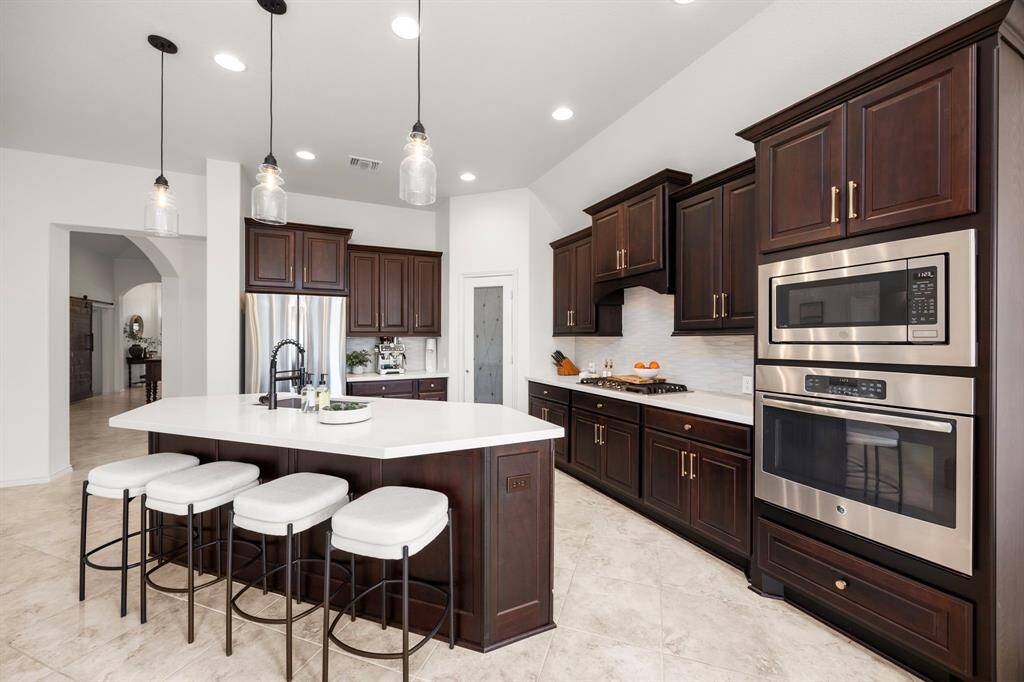 Gourmet chef's kitchen fully equipped with lots of counter space & all the modern conveniences.