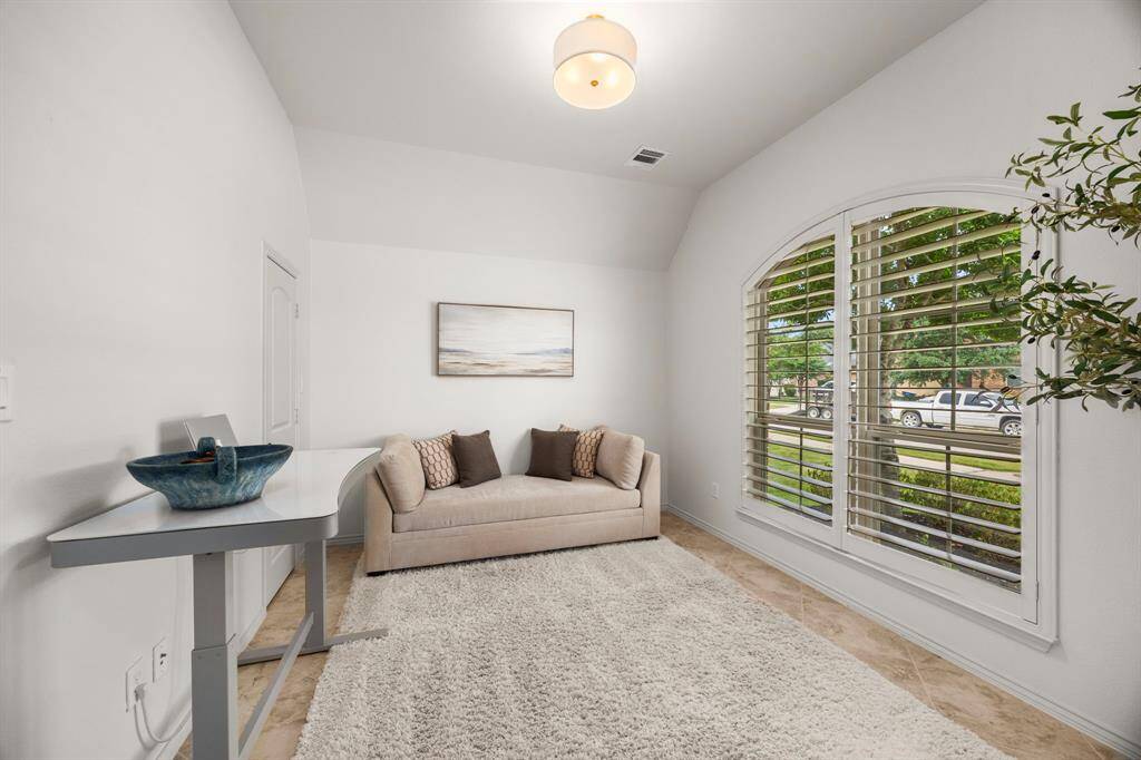 Flex room can be a home office/work out studio or library. Can also be easily converted to a 4th bedroom fully equipped with closet, custom plantain shutters and tile flooring. Jack & Jill bath in connecting hallway to additional secondary bedroom.