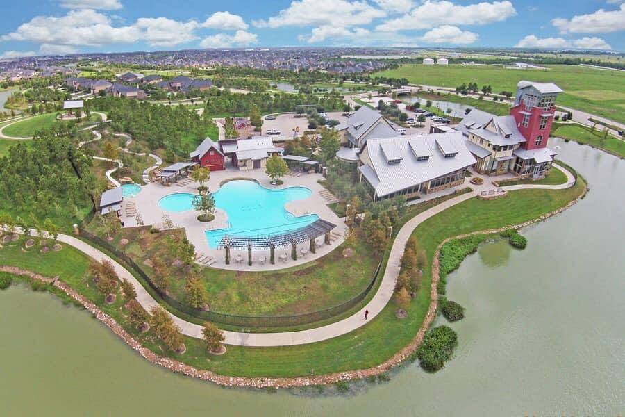 Ariel view of the welcome center, fitness center, adventure pool & water slides.