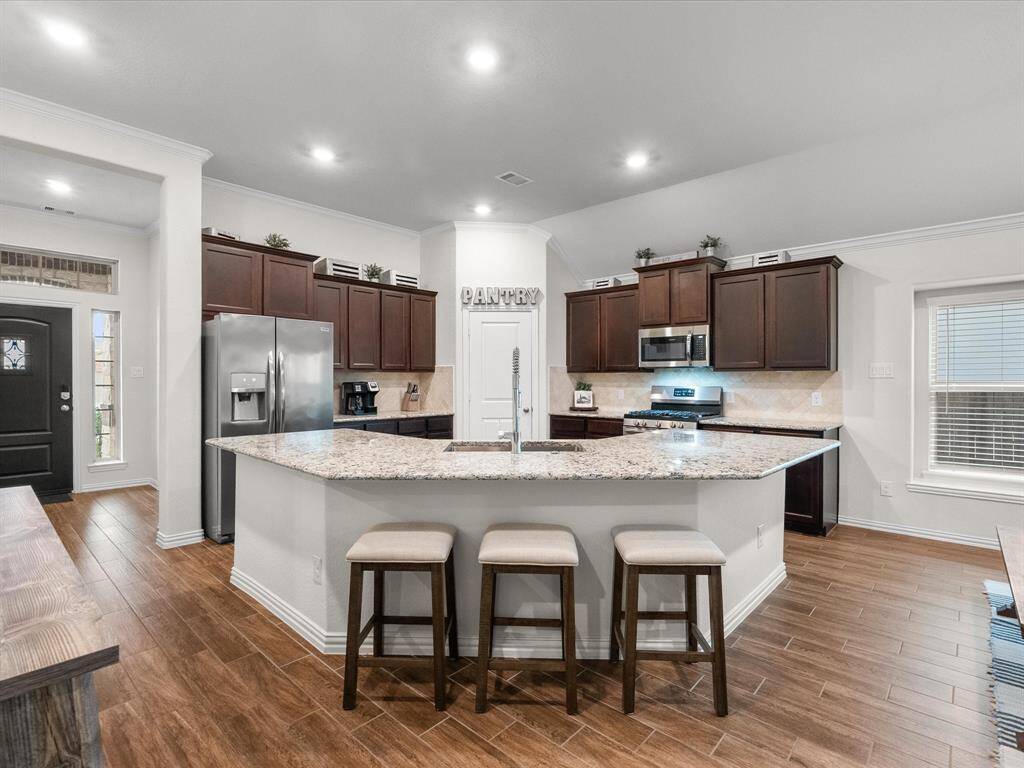 Open concept living with the kitchen open to dining and living space.