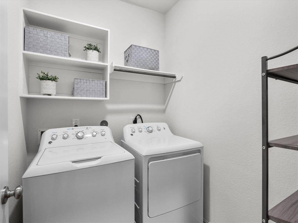 Generous sized laundry room with plenty of space to work and organize.