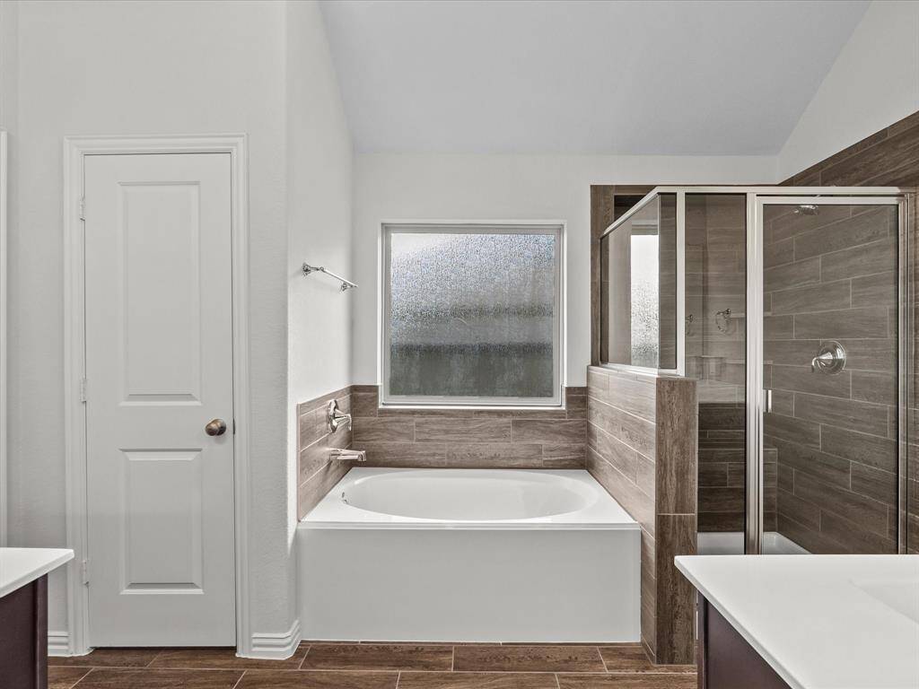 Soaking tub and separate shower.