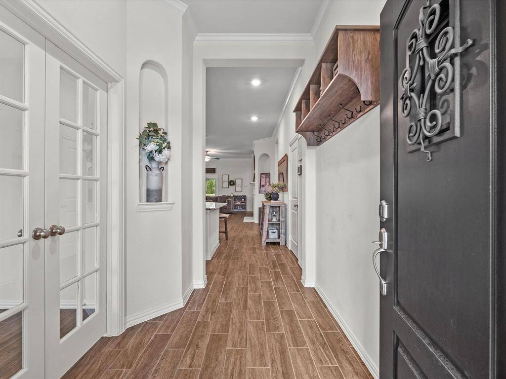 Beautiful entry! Wood-like tile flooring throughout living space.