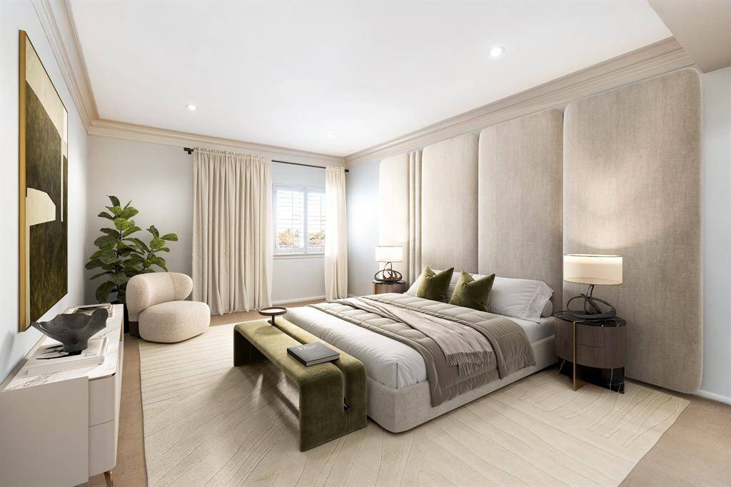 Large primary suite with recessed lighting, crown molding and neutral tones. Image shown virtually staged.