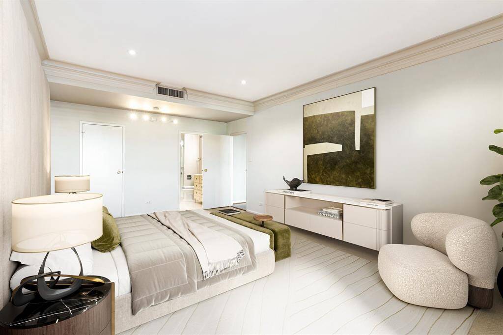 Another view of the bedroom with views of the walk-in closet and bathroom. Image shown virtually staged.