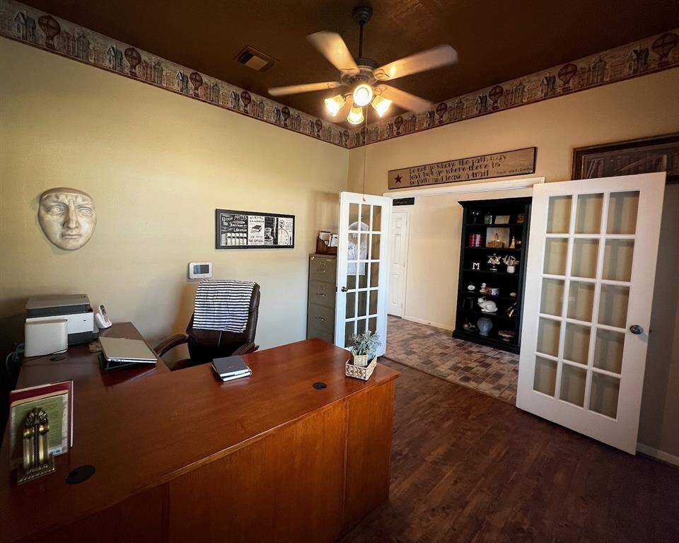 Located at the front of the home this inviting space is complete with complimentary wood floors and warm toned, high ceiling. Whether you're working from home or managing life’s details, this serene office space keeps you motivated & on task.