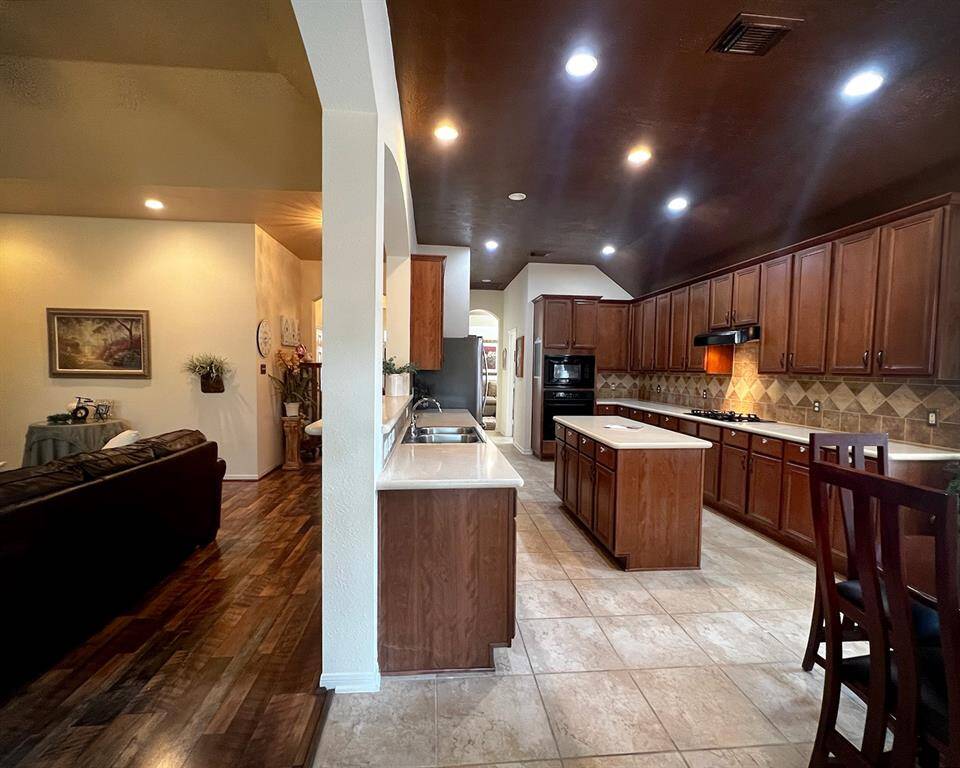 You'll have storage galore in this large, island kitchen designed with large 42" cabinets!