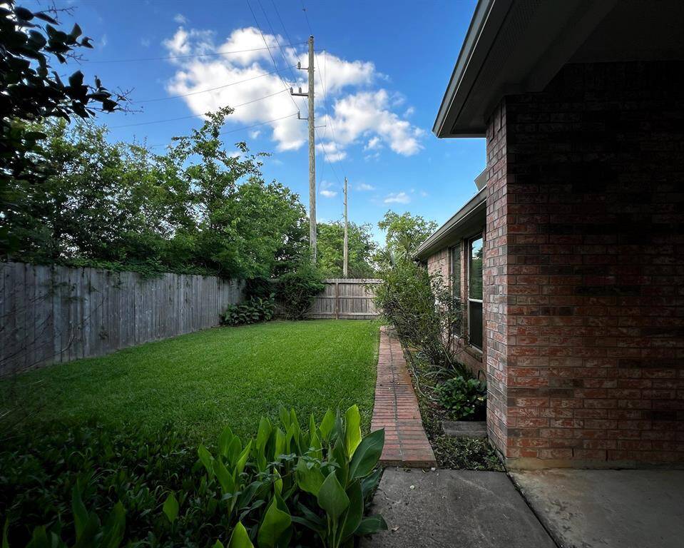 This home is 4 sides brick and has healthy green grass in the backyard.