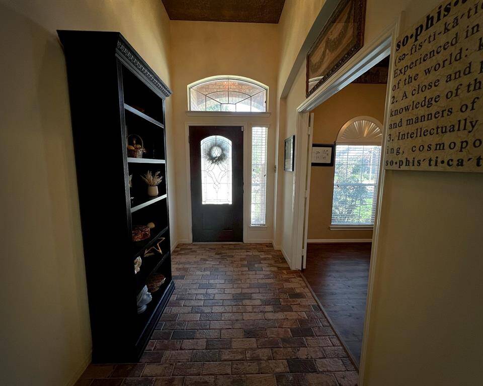 This view is closer to the front door and you see the study off to the right.