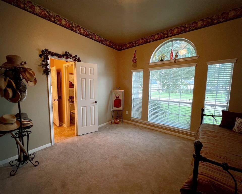 A comfortable secondary bedroom to make your own is located at the front of the home with excellent windows, large walk-in closet and connecting bathroom.