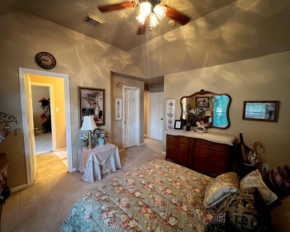 The third bedroom, also features those high ceilings, a large walk-in closet, and adjoining full bathroom.