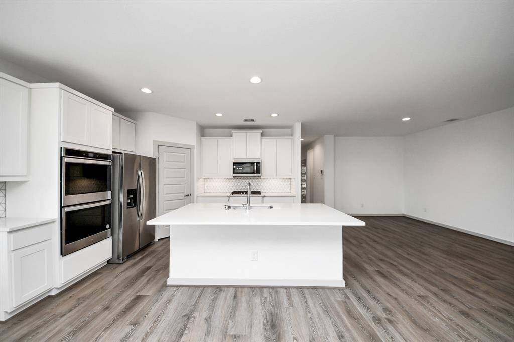 Culinary dreams come true! This sparkling kitchen is perfect for whipping up a storm, and the open layout to living area lets you entertain in style.