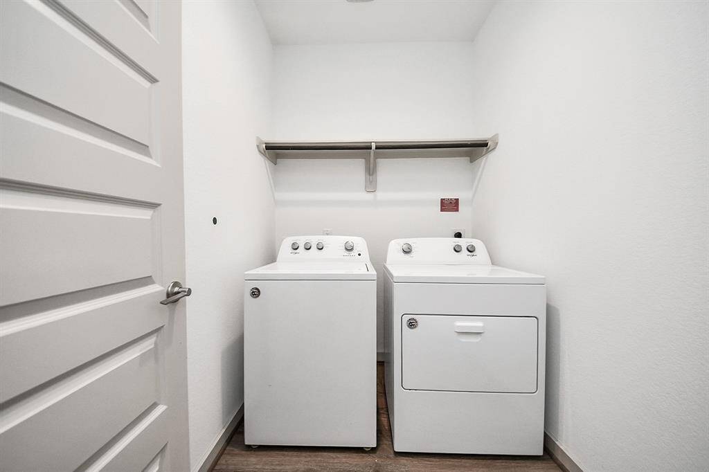 Laundry day just got a whole lot easier! This spacious laundry room comes complete with washer and dryer!