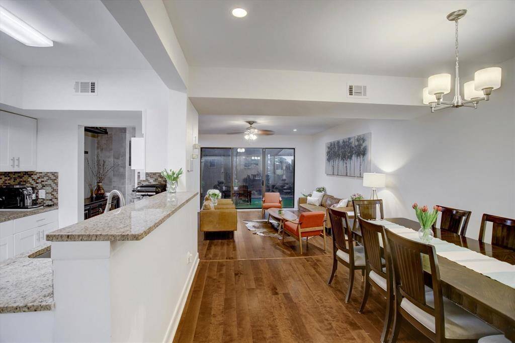 Spacious first floor living, dining, and kitchen with gaslog fireplace