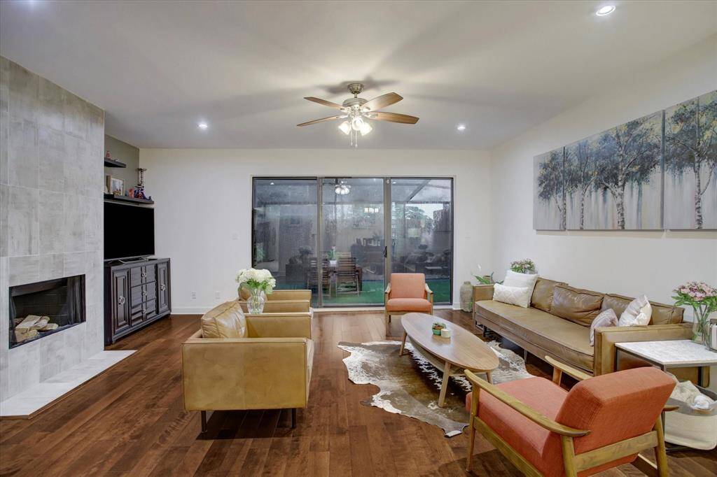 Spacious first floor living, dining, and kitchen with gaslog fireplace