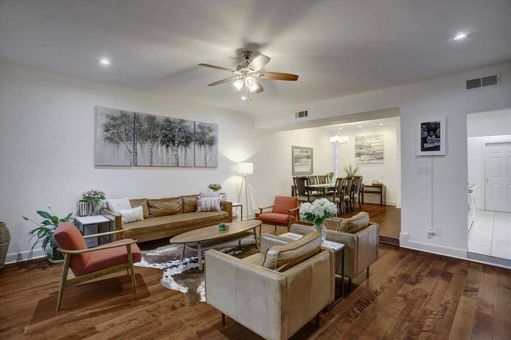Spacious first floor living, dining, and kitchen with gaslog fireplace
