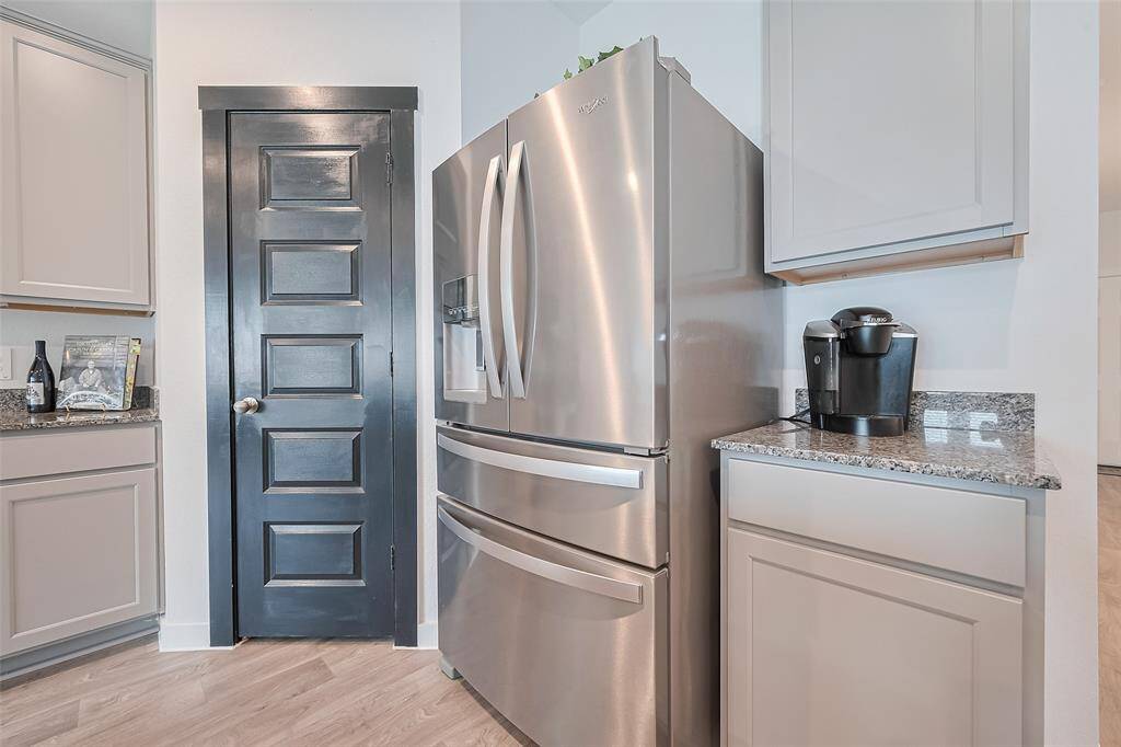 Plenty of space allows for full-size appliances in the kitchen, with a layout designed for both functionality and flow.