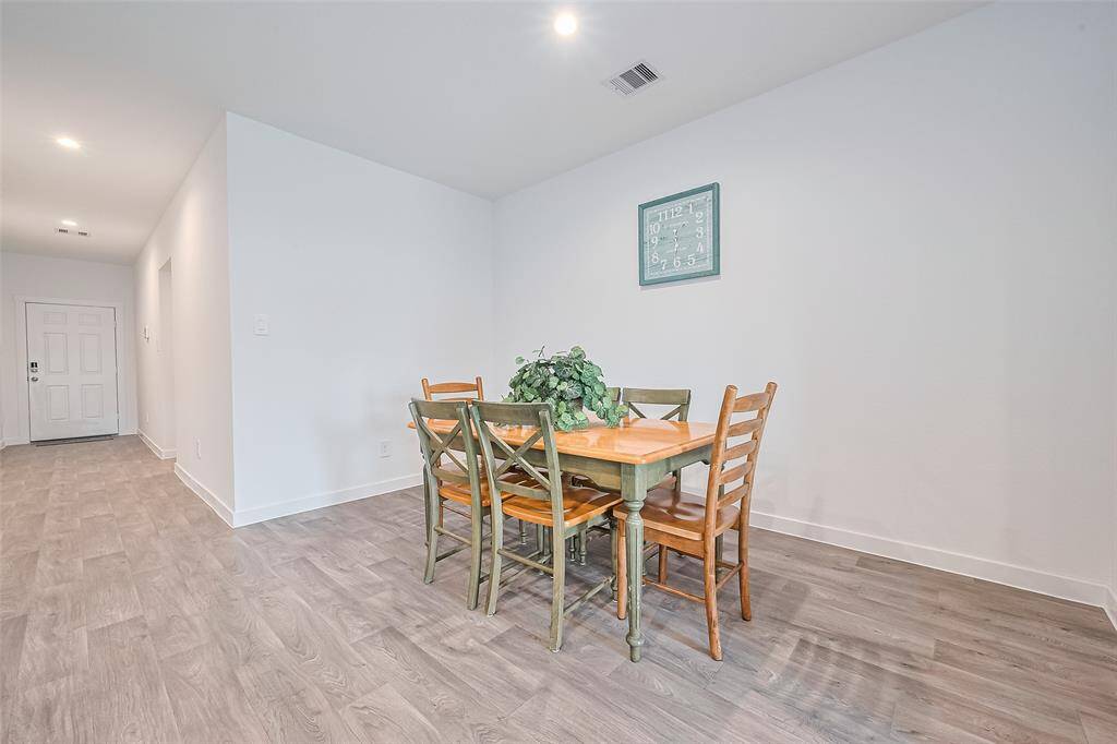 Generous proportions in the dining space offer plenty of room to gather, with natural flow from one area to the next.