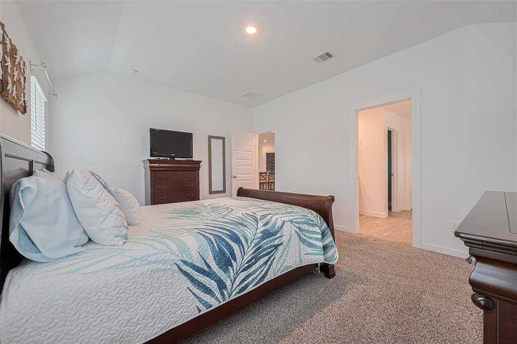 Conveniently located near the main living area, the primary bedroom offers both comfort and privacy.