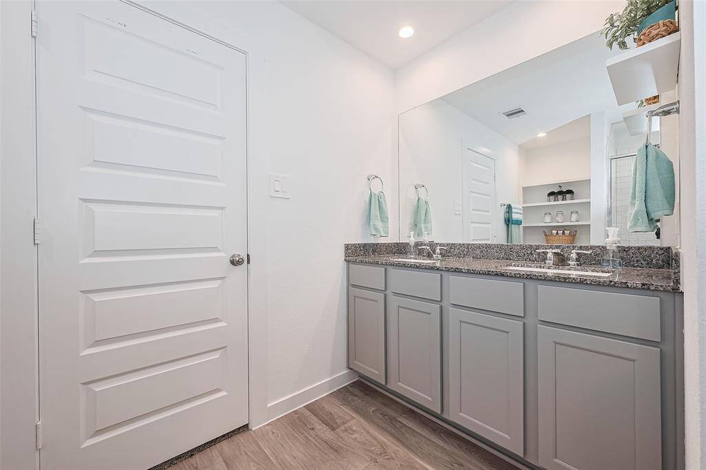 The vanity offers abundant storage below, making daily routines both simple and stylish.