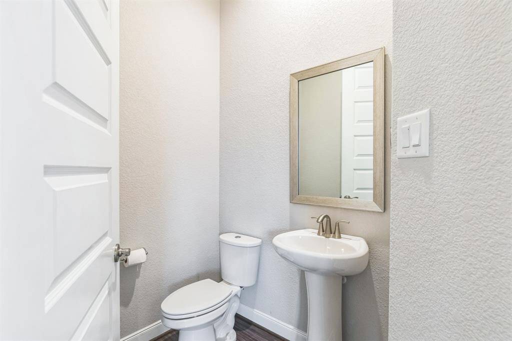 Half bathroom, located off of the living room