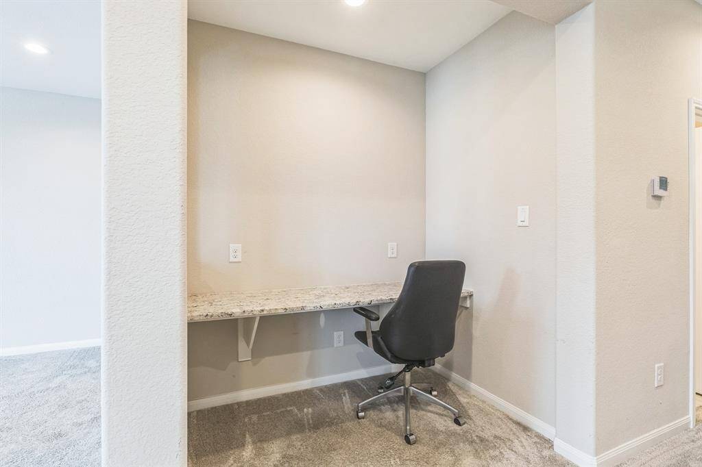 A built-in desk can be found upstairs