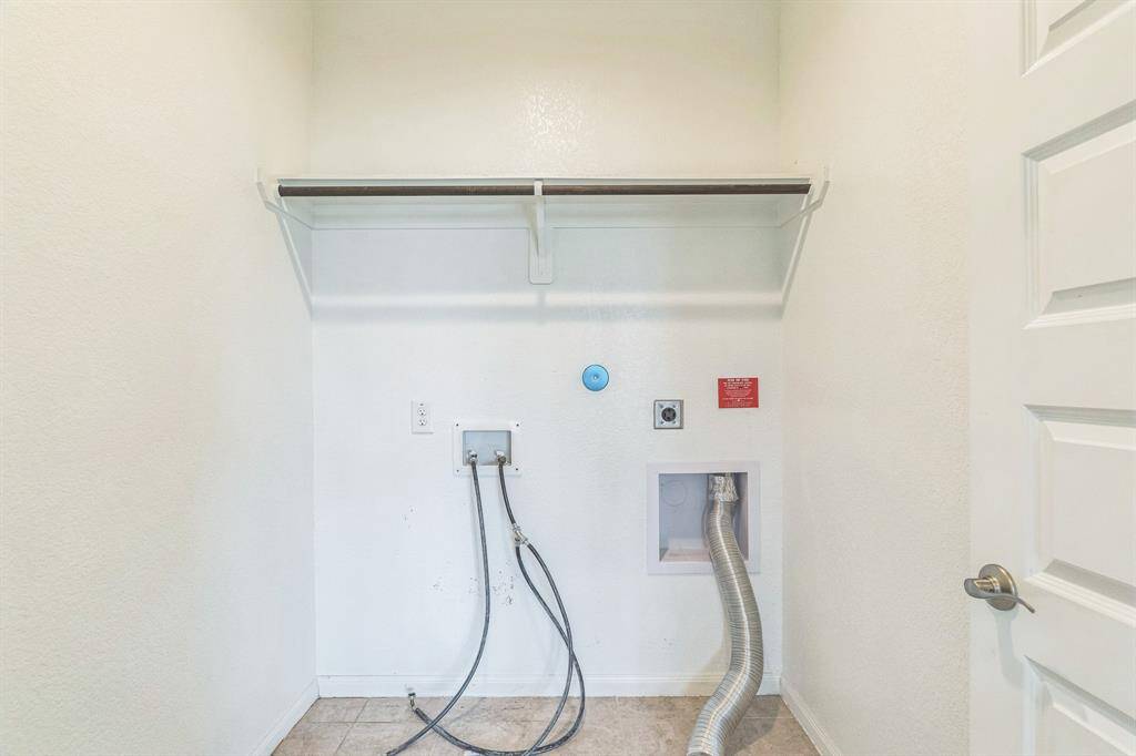 The laundry room is located upstairs