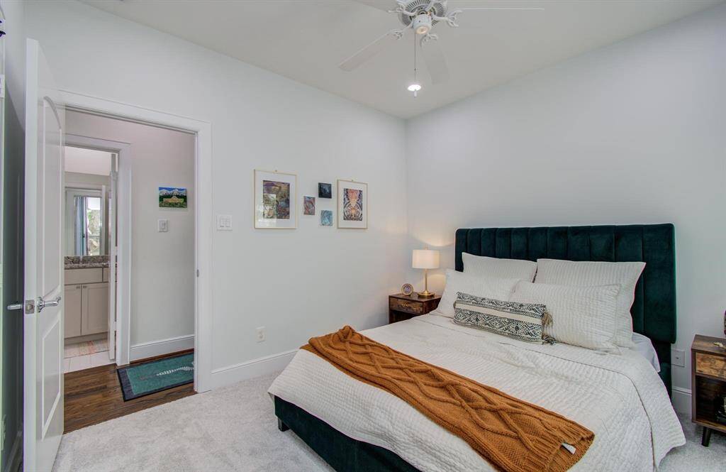 Light and bright secondary bedroom—perfect as a guest room or home office. Versatile and inviting with great natural light.