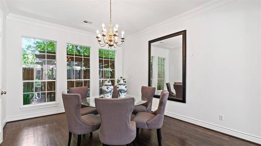 Formal dining with big windows to allow in natural light