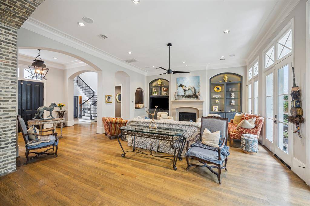 Gorgeous view of the living room from the kitchen. Notice the built-in shelving flanking the fireplace.